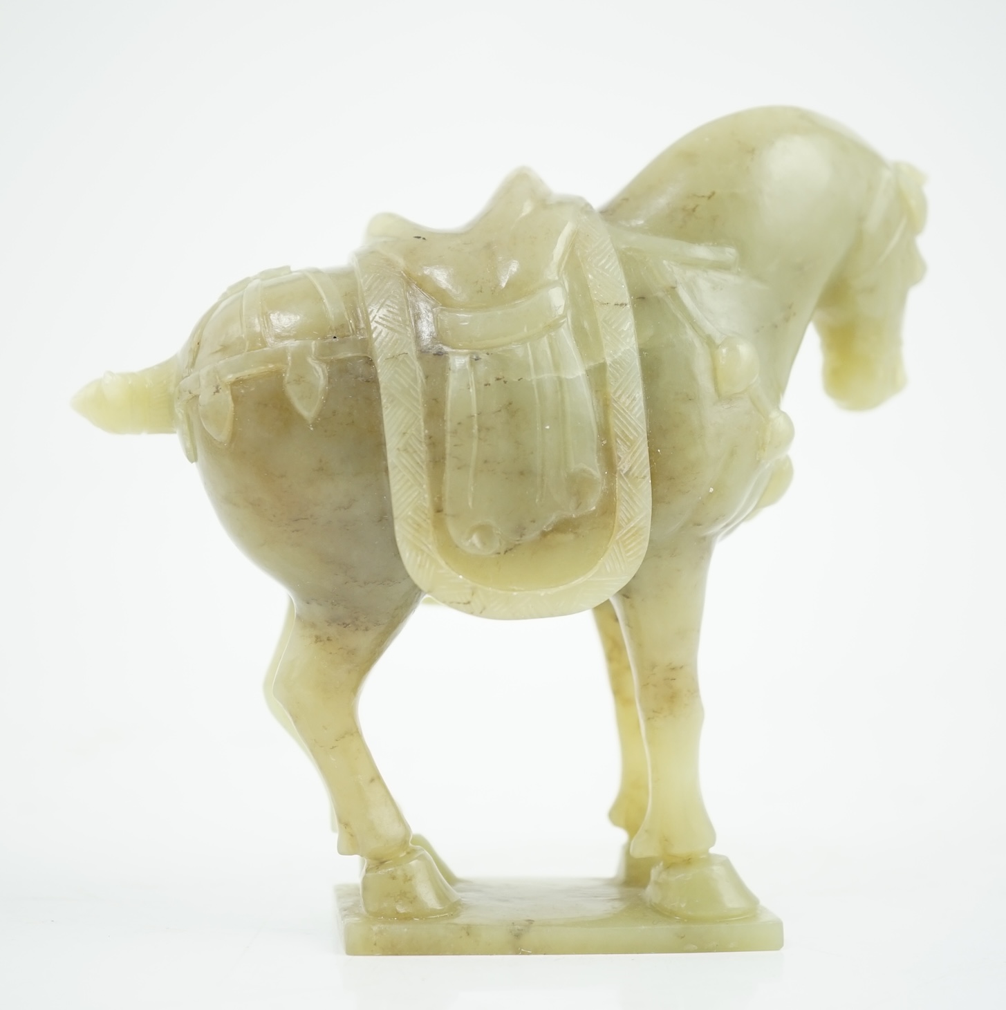 A Chinese celadon jade figure of a horse, early 20th century, 12cm high